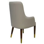 Fauteuil de salle à manger en cuir avec pieds en bois à accents dorés pour cuisine et intérieur modernes